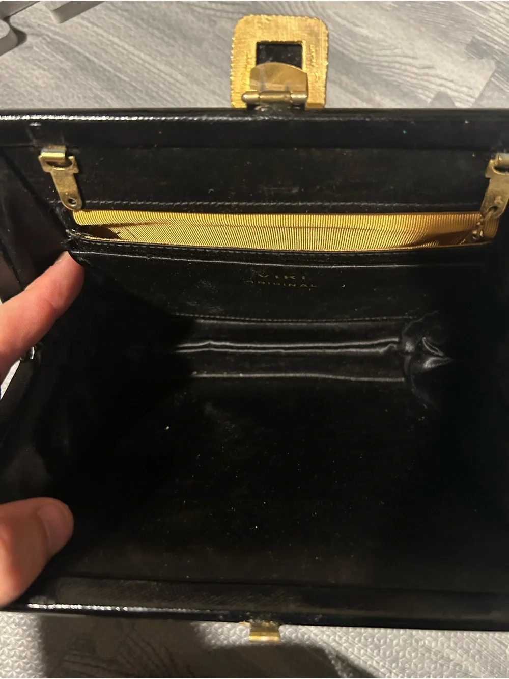 Elegant Black Evening Clutch with Decorative Gold Accent